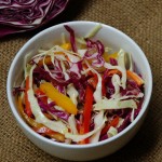 A kicky coleslaw with an oil & vinegar dressing from ascrumptiouslife.com