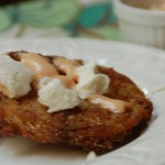 A fried green tomato with goat cheese and remolade sauce from ascrumptiouslife.com
